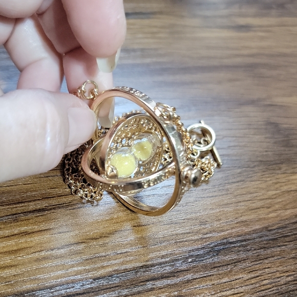 Jewelry - Hourglass Gold Tone Rotating Pendant Necklace